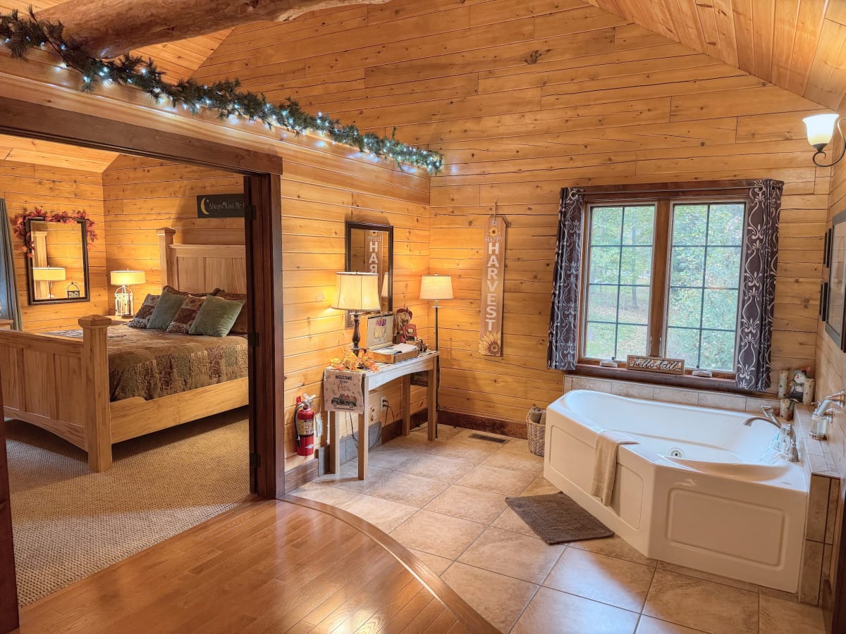 Indoor jacuzzi for two beside the king bedroom inside Sycamore Lane Cabin at Ferngully Creek